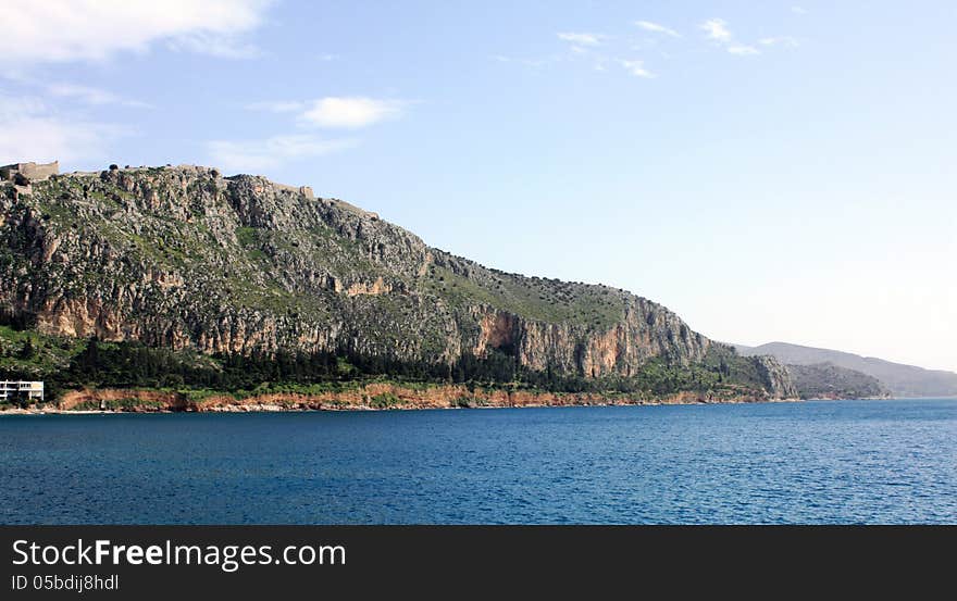 A beautiful mountain with a trail along the nafplio coast. A beautiful mountain with a trail along the nafplio coast.