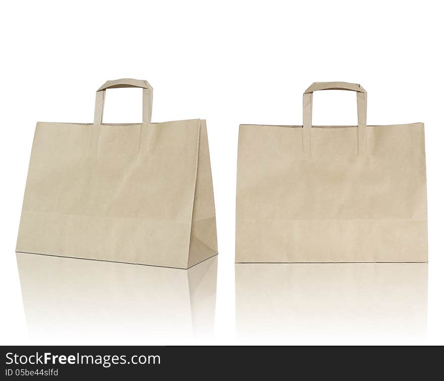 Brown paper bag on reflect floor and white background