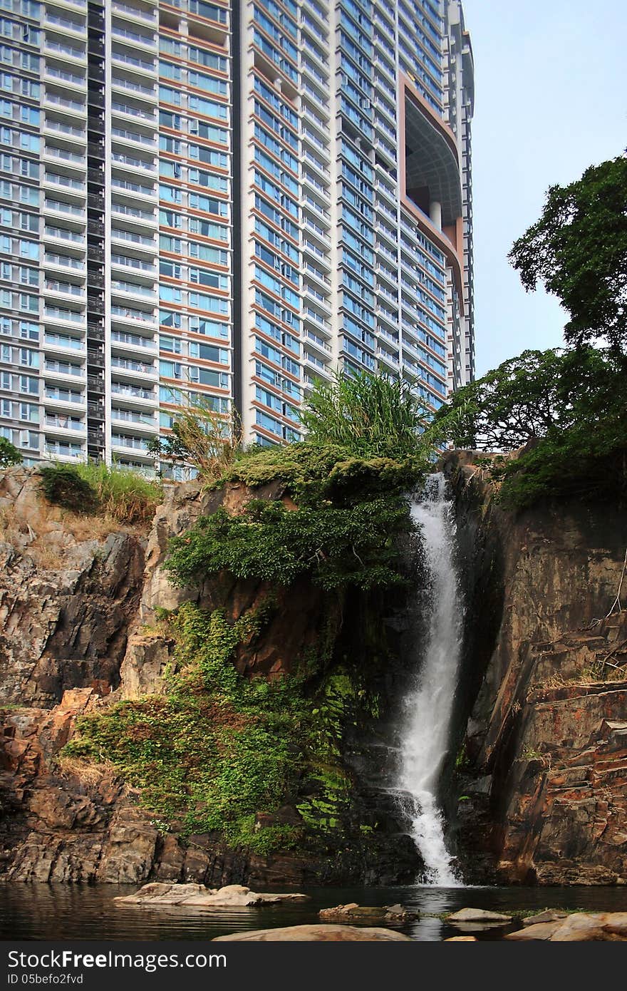 The architecture and nature, skyscrapers and waterfalls are located side by side on Hong Kong Island.