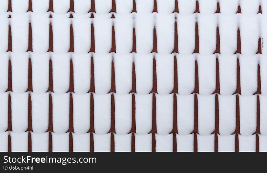 Snow on metal tiles roofing