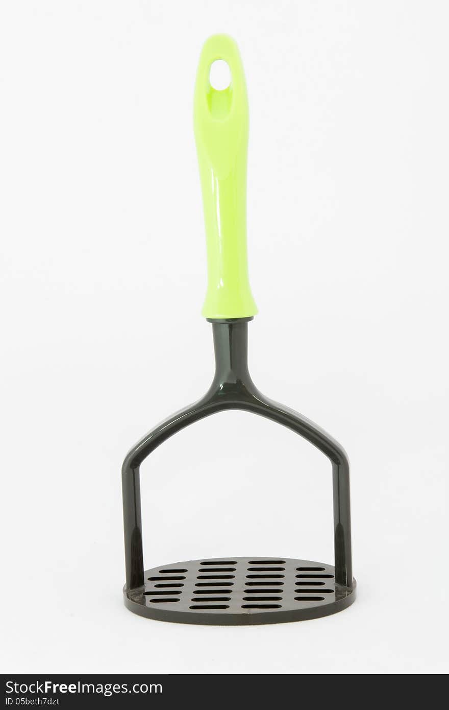 Plastic potato masher on white background