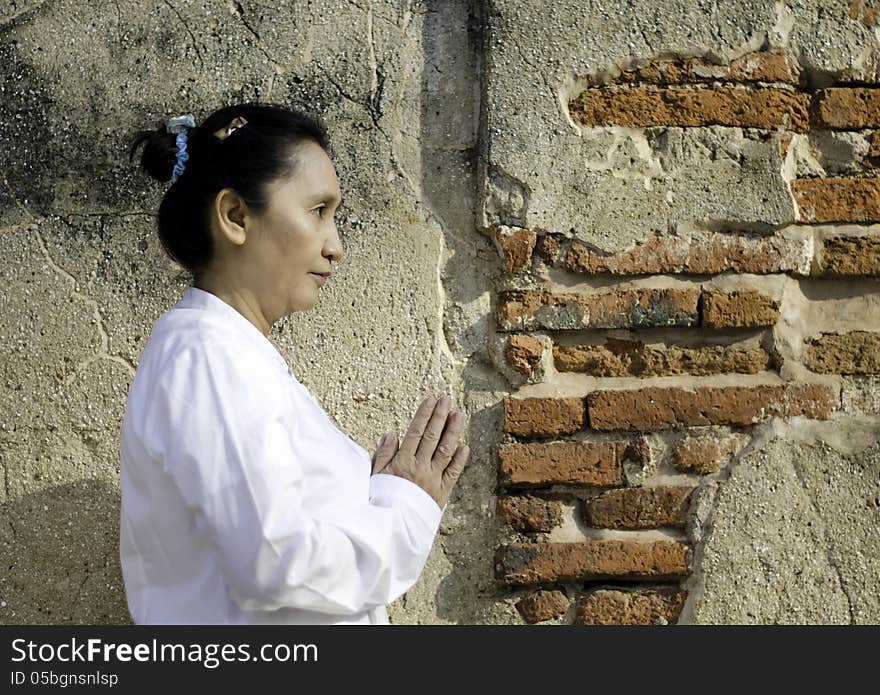 Thai woman in traditional style clothes with typical welcome expression. Thai woman in traditional style clothes with typical welcome expression