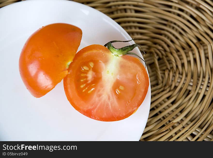 Fresh tomato on plate