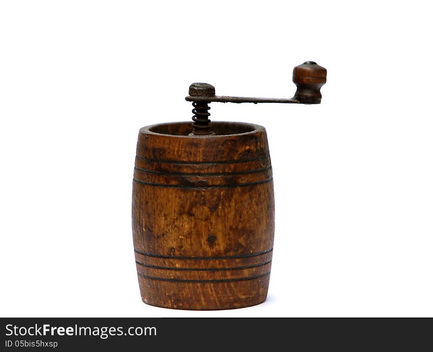 Vintage pepper grinder made ​​of wood and metal. Vintage pepper grinder made ​​of wood and metal