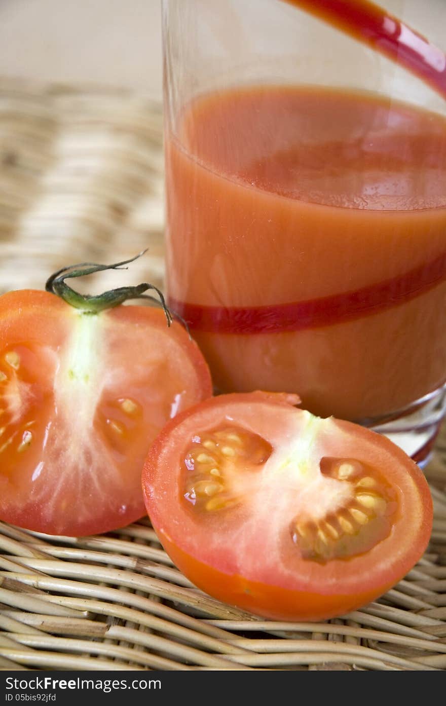 Half of tomato with tomato juice