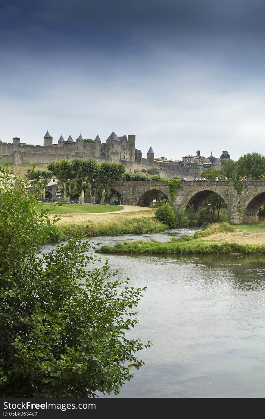 The beautiful fortified town of Carcassonne and Pont Vieux bridge in Southern France, seen from across the Aude river