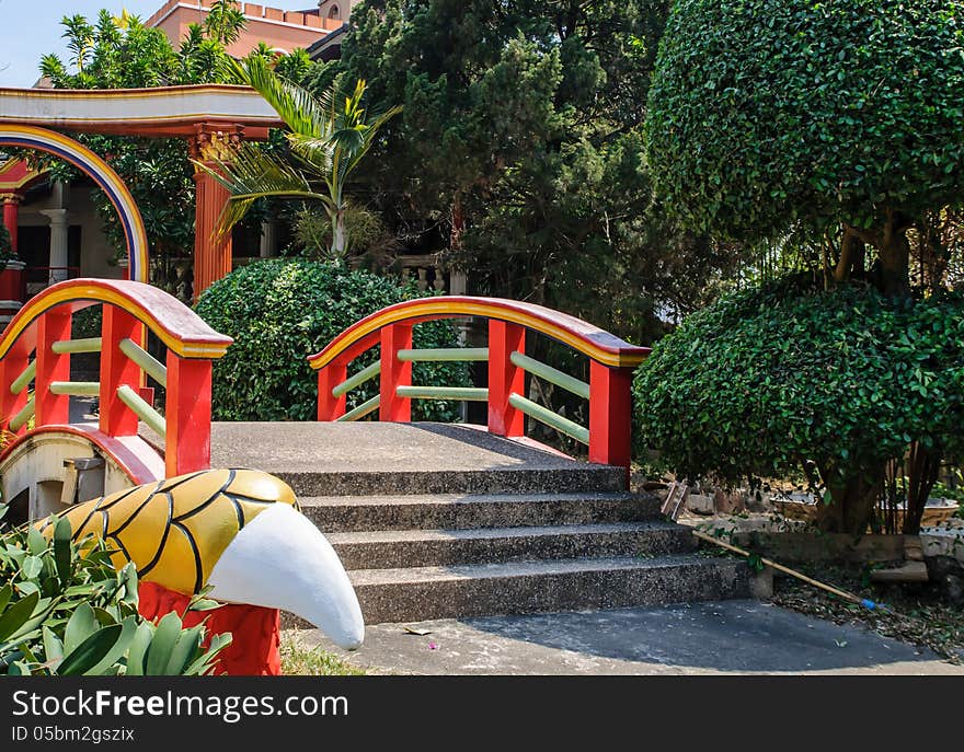 Chinese garden with red bridge