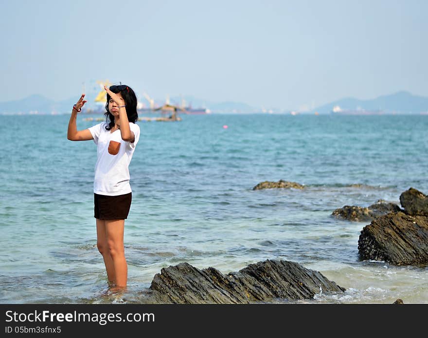 Funny young woman on beach