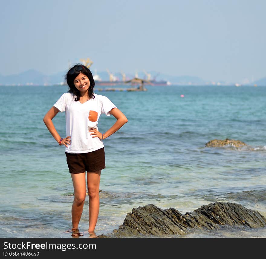 Beautiful young woman on beach