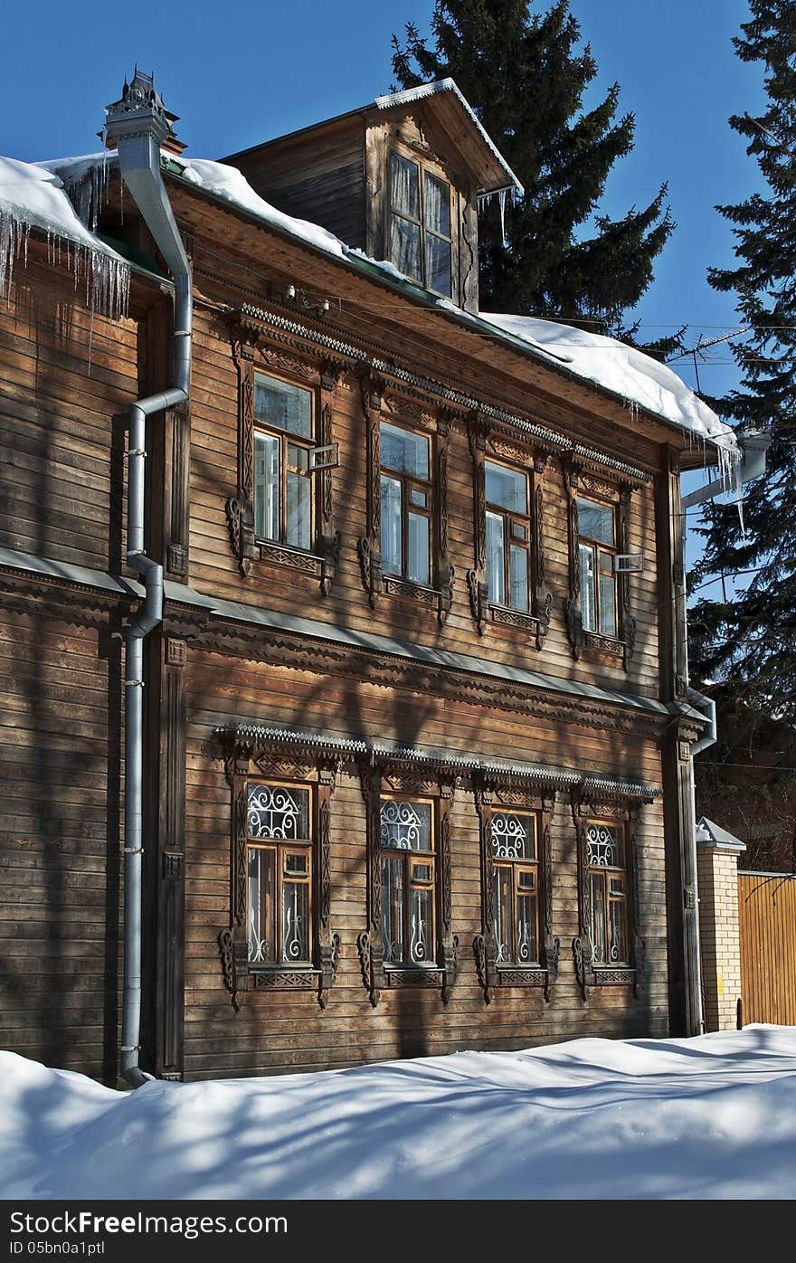 Old two-story wooden house, winter sunny day. Old two-story wooden house, winter sunny day