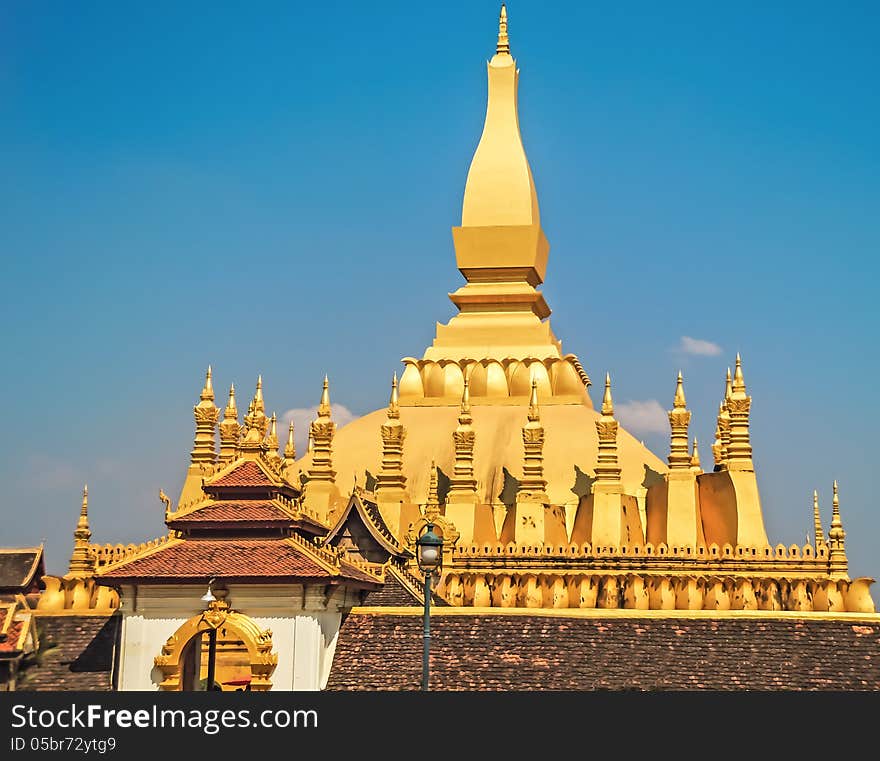 Lao golden stupa with blue sky background