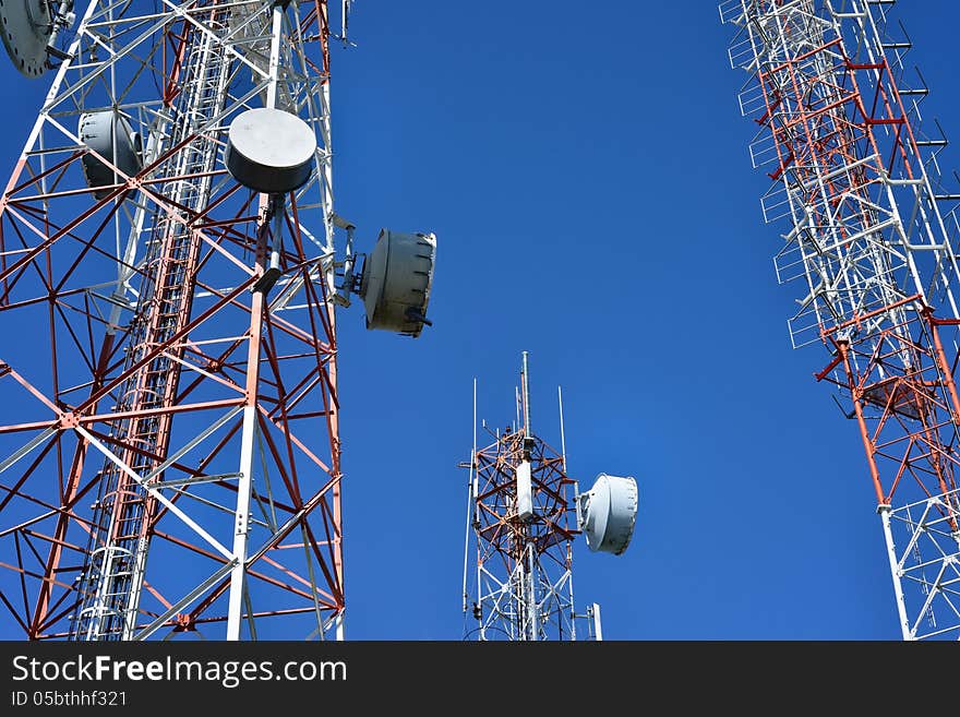 Telecommunication tower with a sunlight. Used to transmit television signals.