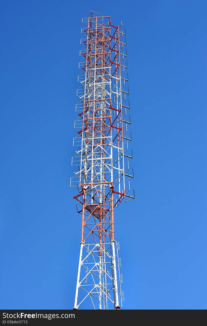 Telecommunication tower with a sunlight. Used to transmit television signals.