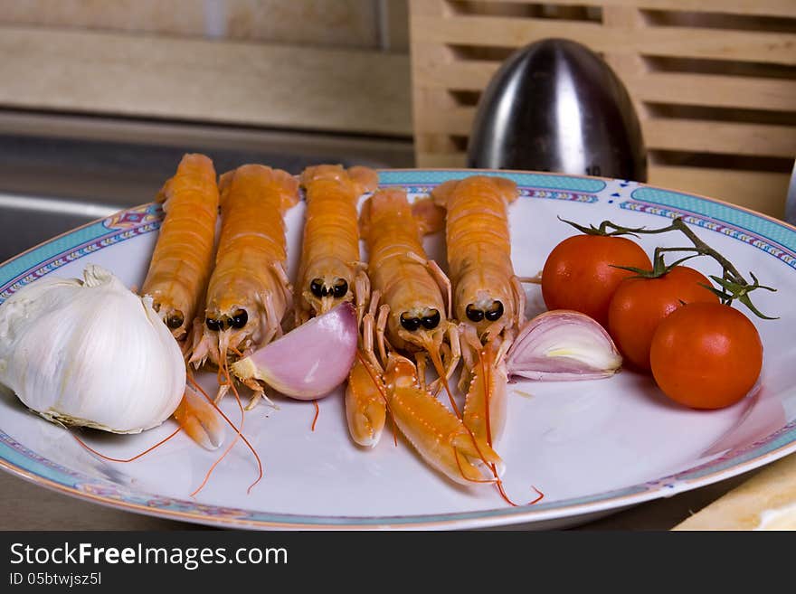 Prawn and tomato plate on show before cooking. Prawn and tomato plate on show before cooking