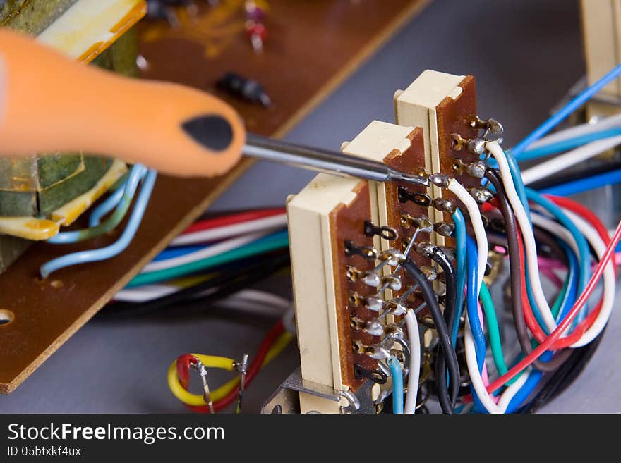 Electric device being repaired by an electrician