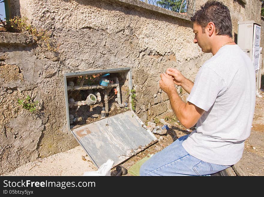 Plumber at work with repairing the pipes. Plumber at work with repairing the pipes