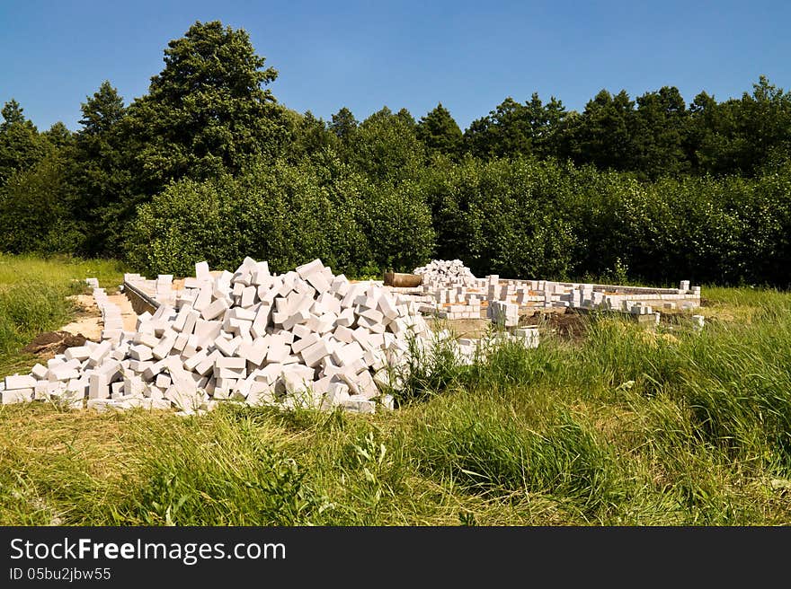 Construction of brick suburban home in the forest