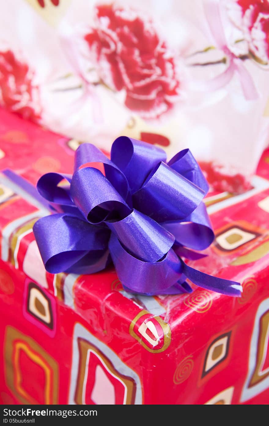 Gift paper box with blue ribbon bow