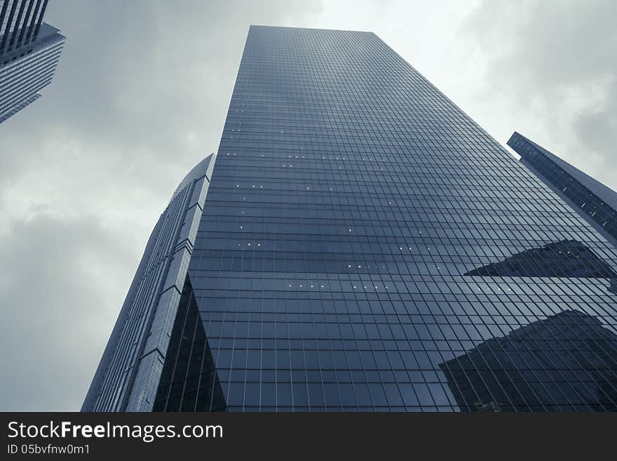 Modern skyscrapers and dramatic rainy sky over them. Modern skyscrapers and dramatic rainy sky over them