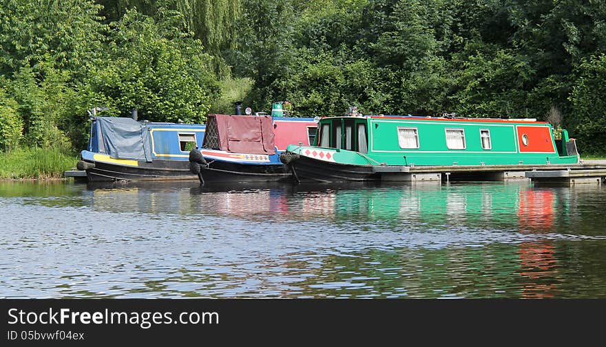 Three Narrow Boats at a Canal Mooring Point. Three Narrow Boats at a Canal Mooring Point.