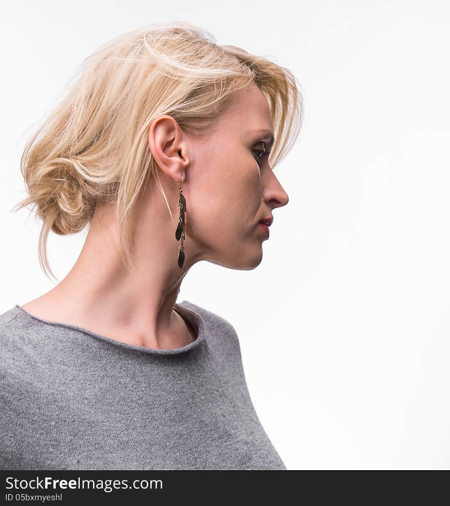 Portrait of young beautiful blond girl with red lipstick on a white background