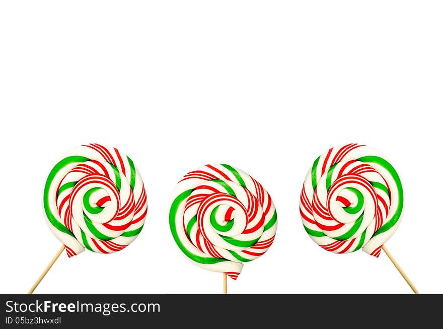 Three Sugar Lollipops In White Green And Red Isolated On White B