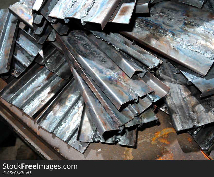 Pile of scrap metal in workshop. Pile of scrap metal in workshop