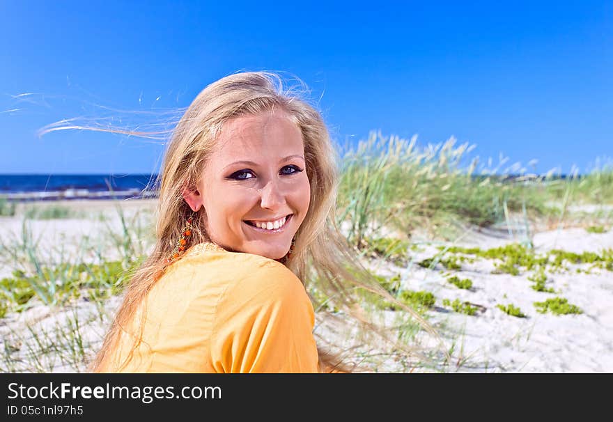 Happy Woman On A Beach