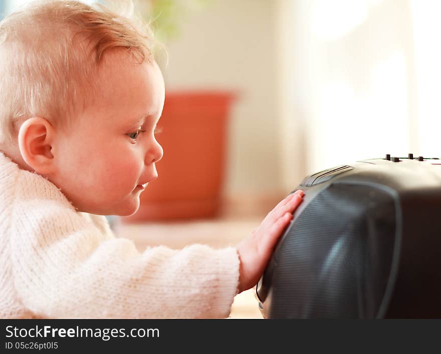 Beautiful little girl playing with a CD player. Beautiful little girl playing with a CD player