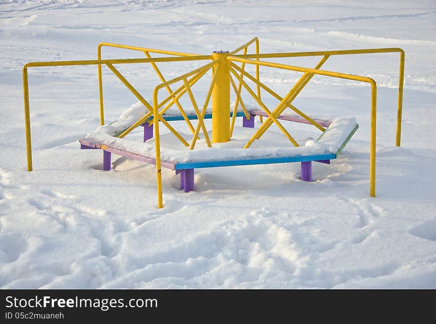 Children's Carousel at snowdrift winter. Children's Carousel at snowdrift winter.