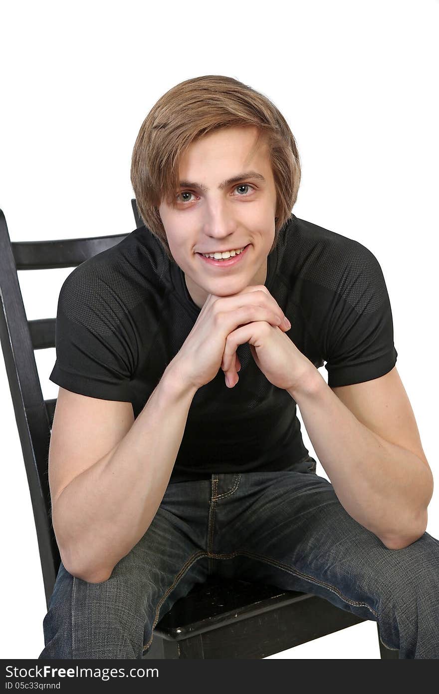 Portrait of handsome young smiling man in black clothes on white background. Portrait of handsome young smiling man in black clothes on white background