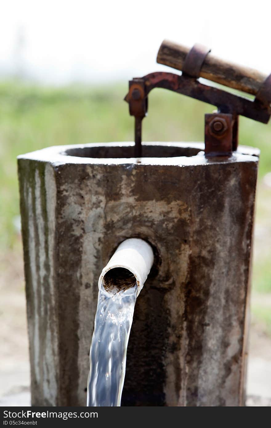 Natural water streamed from the old pump