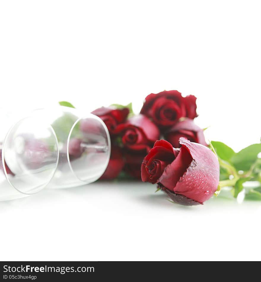 Red rose with wine glass on white background. Red rose with wine glass on white background