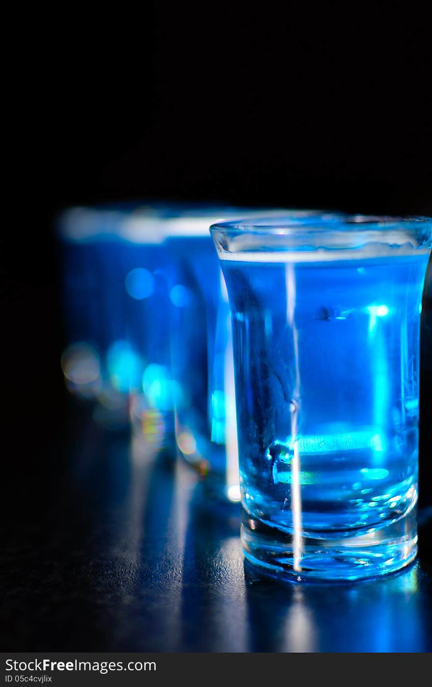 Shoot glasses with blue drink