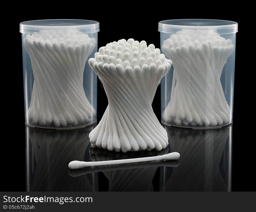 Cotton Buds And Plastic Packing On A Black Background