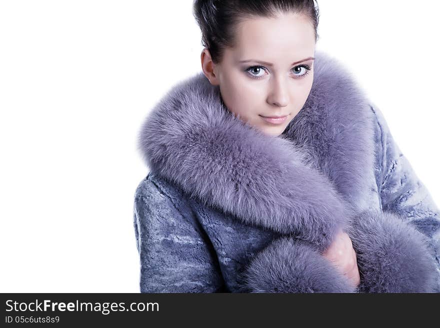 Portrait of beautiful face and impressive eyes brunette woman smiling, wearing luxury, warm, winter fur mink coat. Shot in studio. Isolated on white. Portrait of beautiful face and impressive eyes brunette woman smiling, wearing luxury, warm, winter fur mink coat. Shot in studio. Isolated on white.