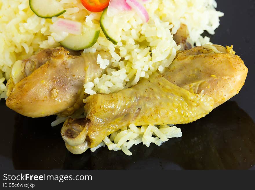 Kgawhmk chicken on a black plate