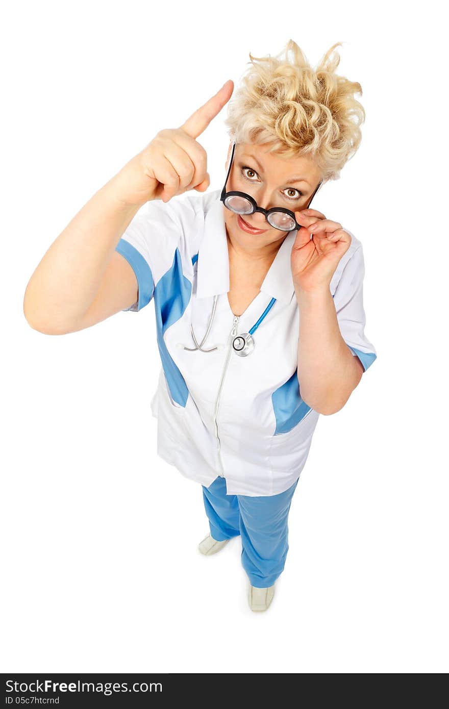 Angry adult woman in medical suit shows finger up in camera and holds glasses on white background. Angry adult woman in medical suit shows finger up in camera and holds glasses on white background