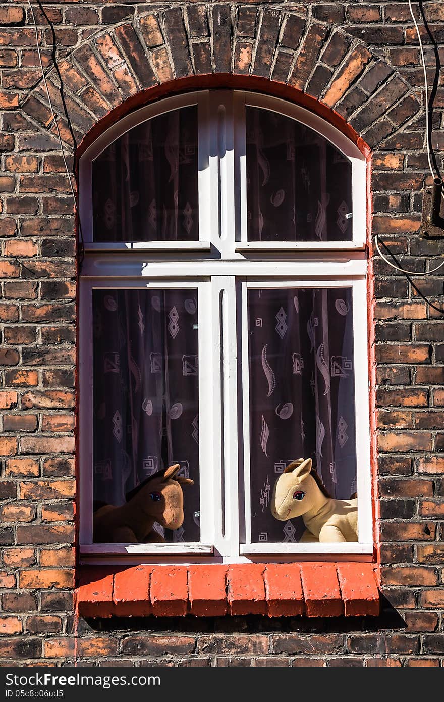 Toys in the window of the residential building