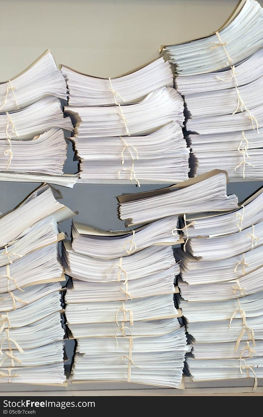 Many folders with documents on the shelves. Many folders with documents on the shelves.