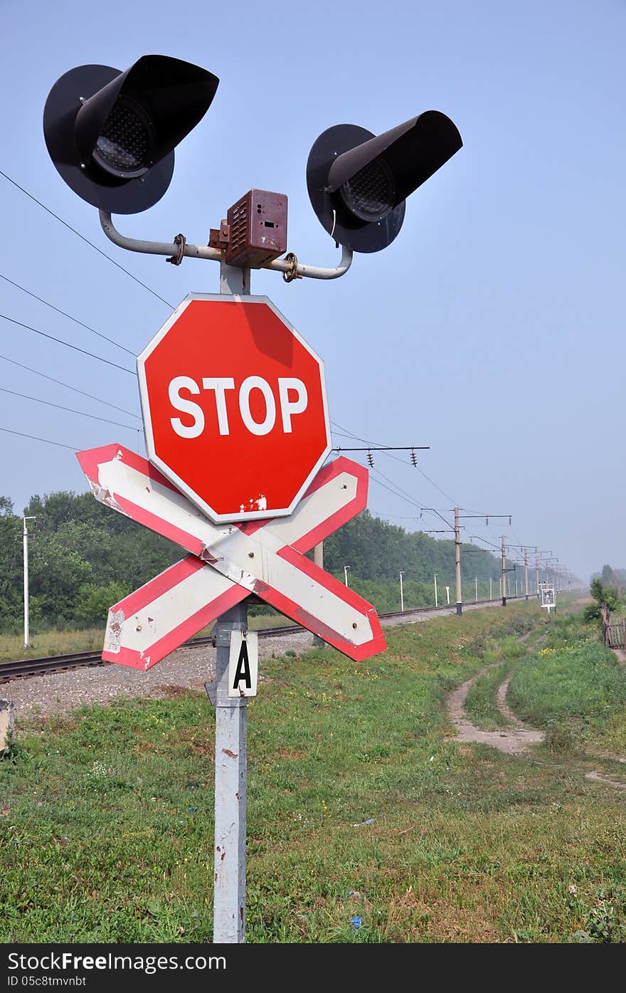 The sign of a stop at a railway crossing. The sign of a stop at a railway crossing.