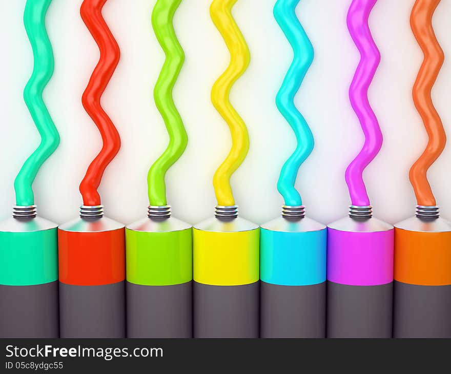 Row of tubes with multicolored paint on white background