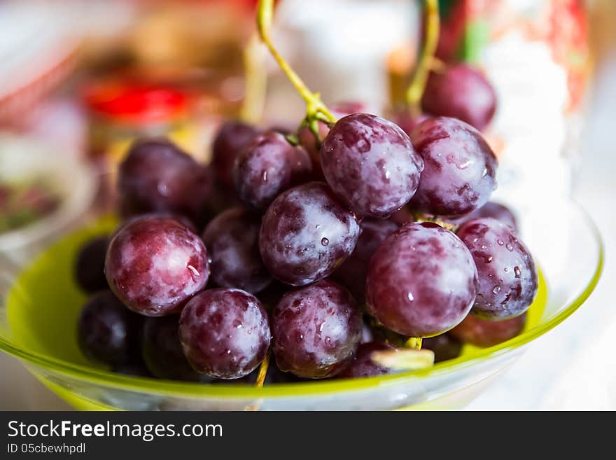 Bunch of tasty red grapes on a plate