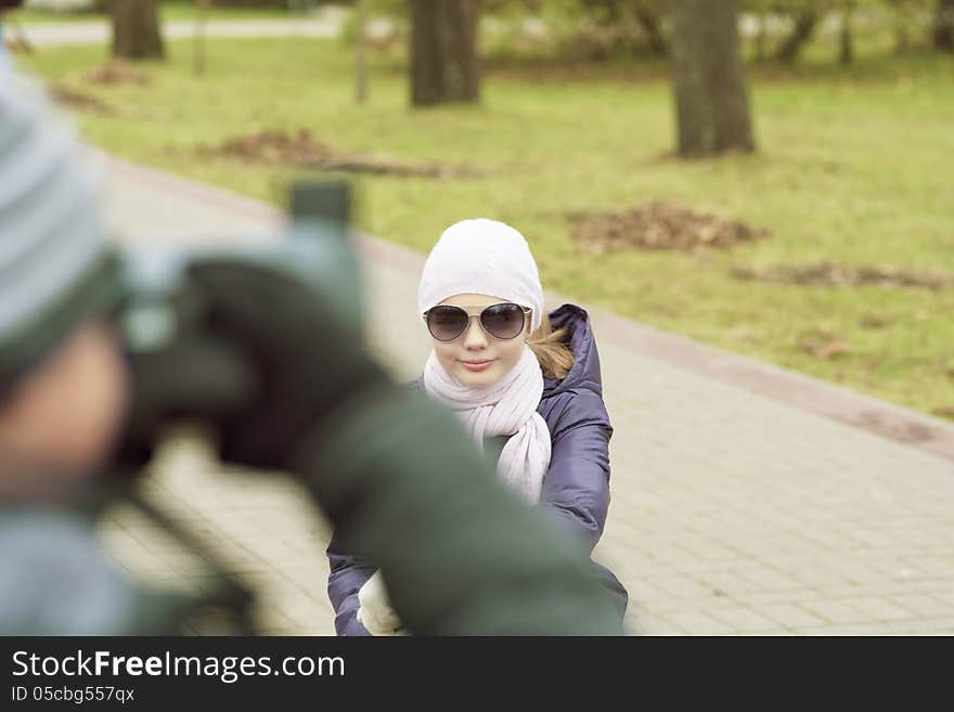 Portrait of two children in park photographing. outdoor shot, horizontal image