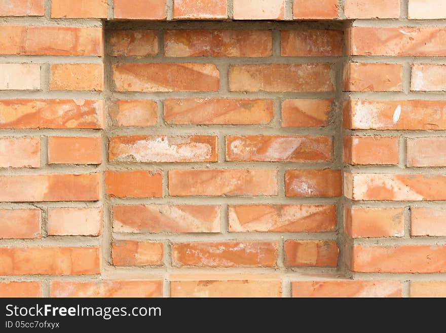 Full frame background of brick red wall with recess. Full frame background of brick red wall with recess