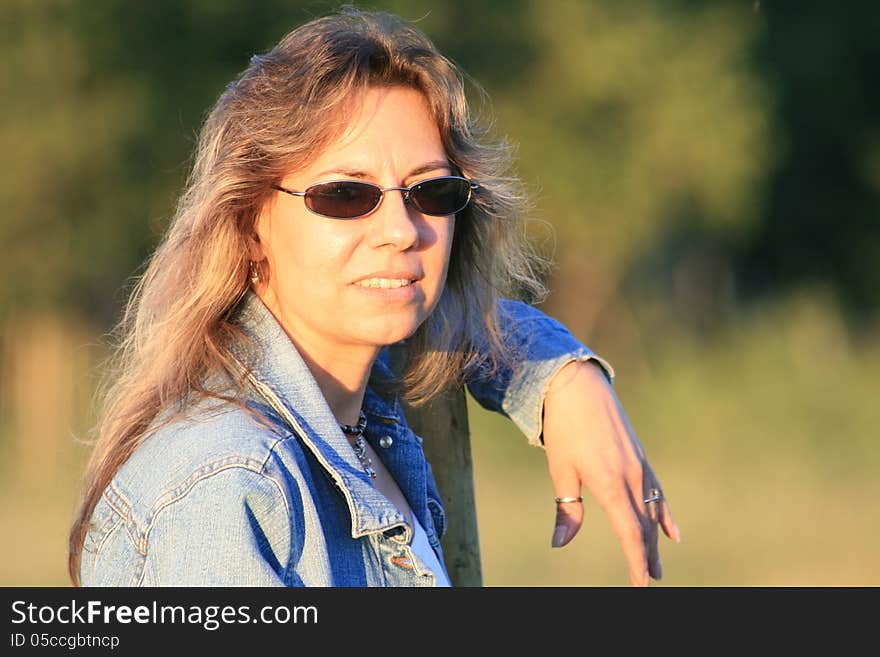 Close up of a woman wearing sunglasses. Close up of a woman wearing sunglasses.