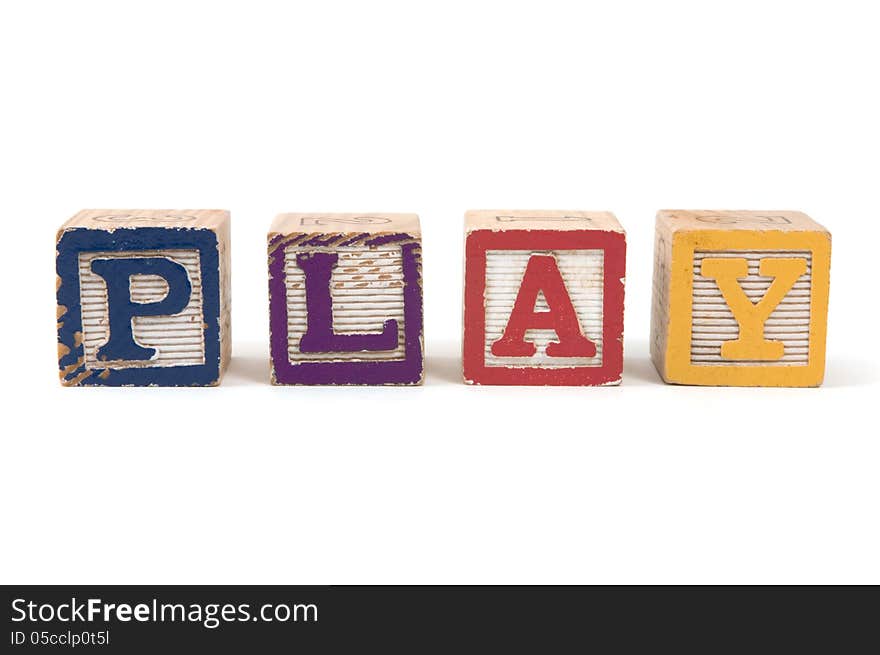 Children's wooden blocks spelling the word PLAY