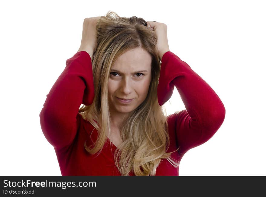 Portrait of a young stressed woman pulling hair isolated on white background. Portrait of a young stressed woman pulling hair isolated on white background