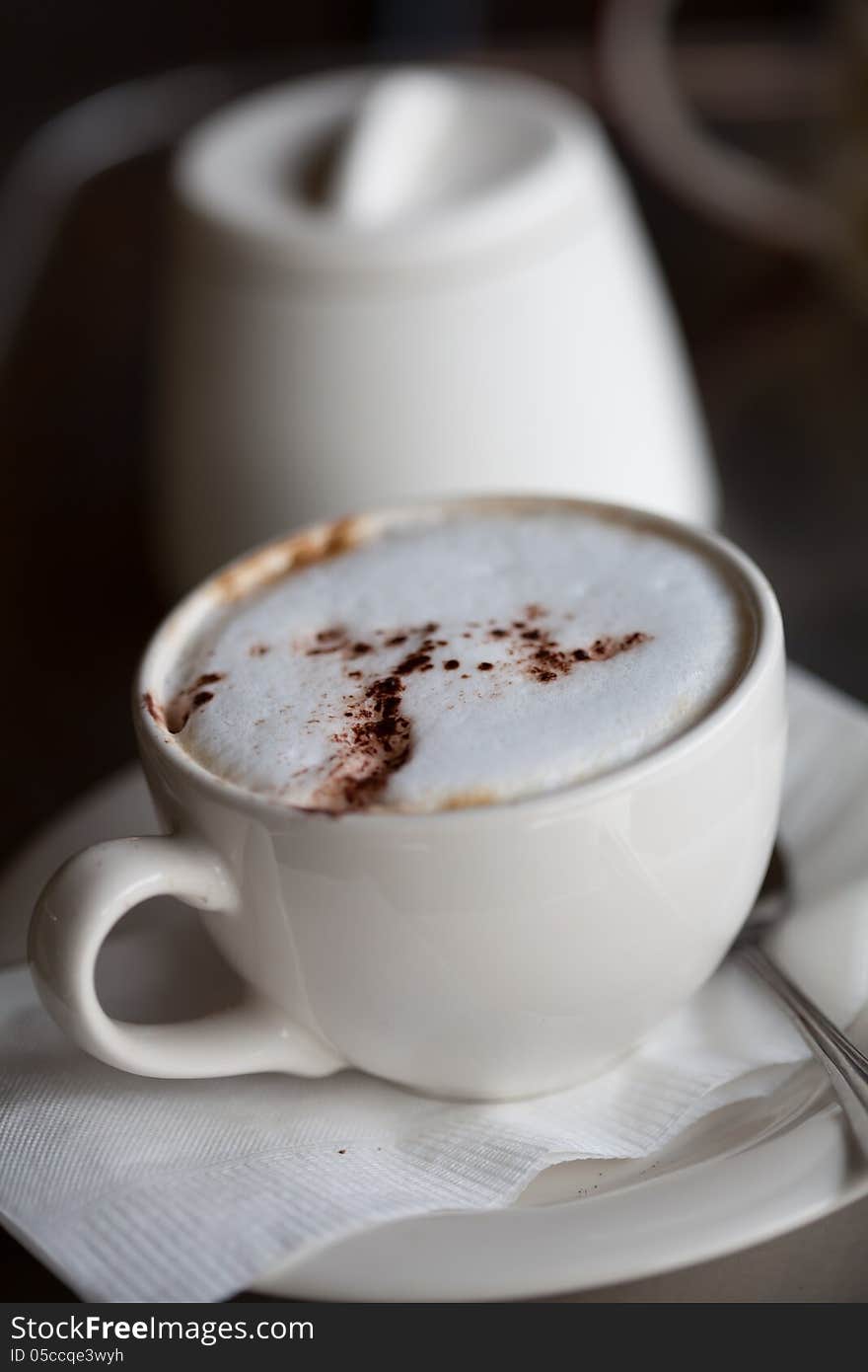 A cup of coffee on a desk