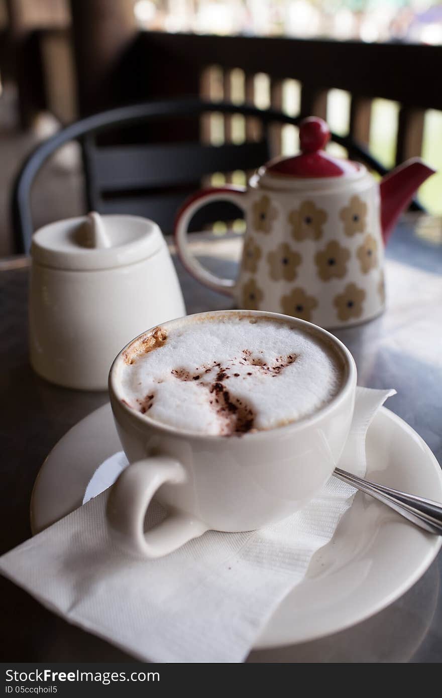 A cup of coffee on a desk